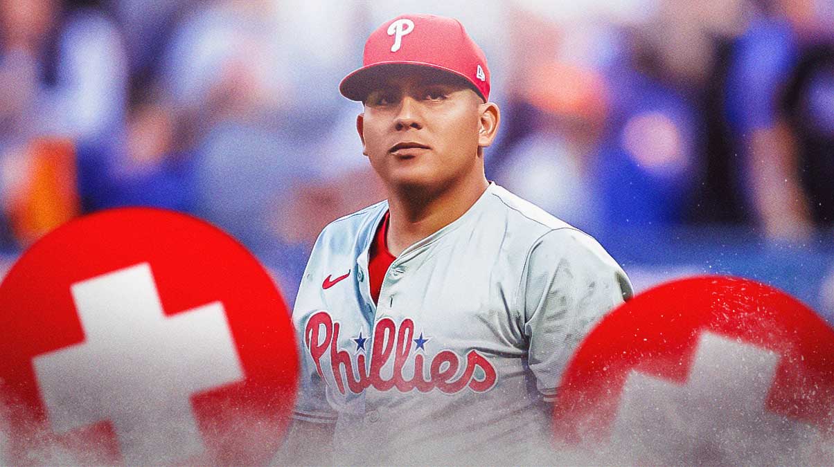 Ranger Suarez in a Philadelphia Phillies uniform with red and white first aid symbol as suarez's injury is making his first start of the sesaon difficult as the phillies injuries continue.