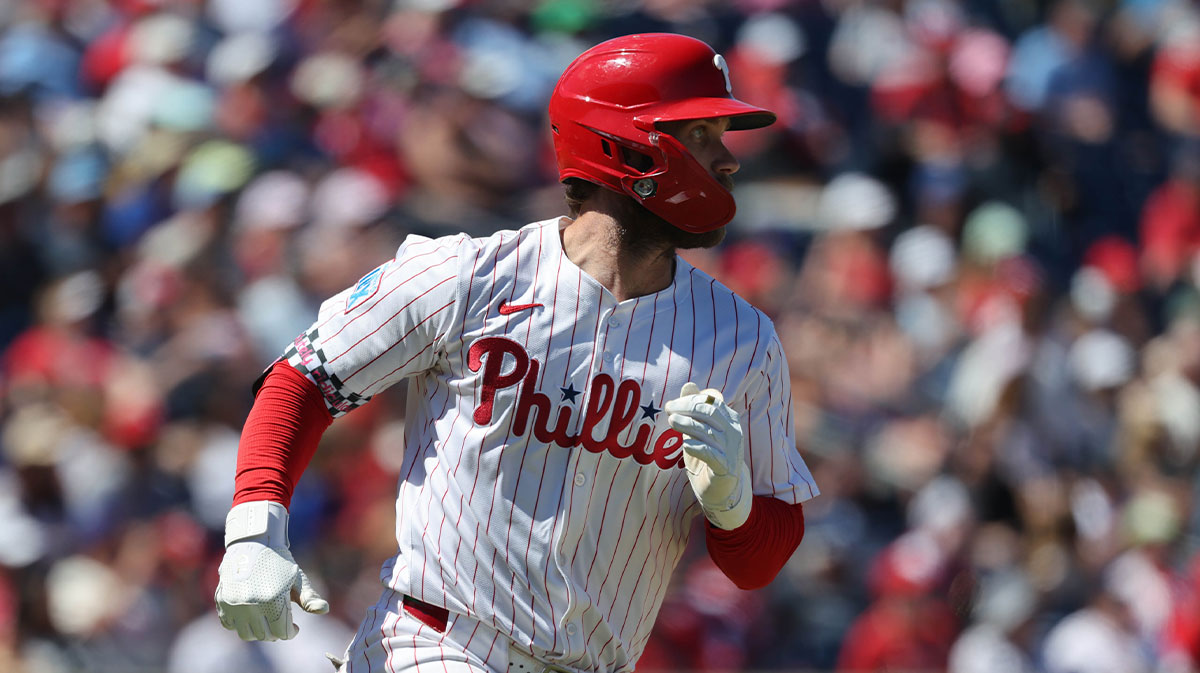 Philadelphia Phillies first base Bryce Harper (3) singles during the sixth inning against the New York Yankees at BayCare Ballpark.