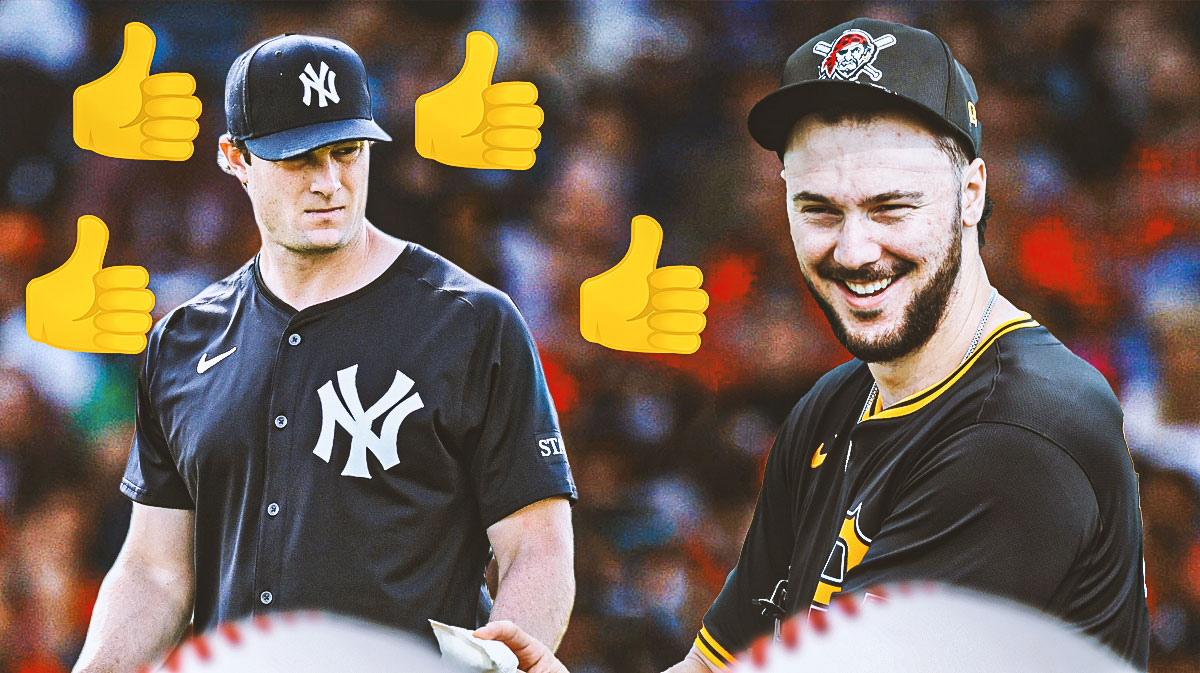 Gerrit Cole with thumbs up around Pirates pitcher Paul Skenes.