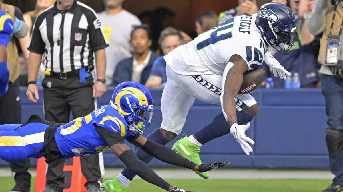 Seattle Seahawks wide receiver DK Metcalf (14) can’t hang on to a pass in the end zone as he is defended by Los Angeles Rams cornerback Emmanuel Forbes Jr. (25) in the first half at SoFi Stadium. 