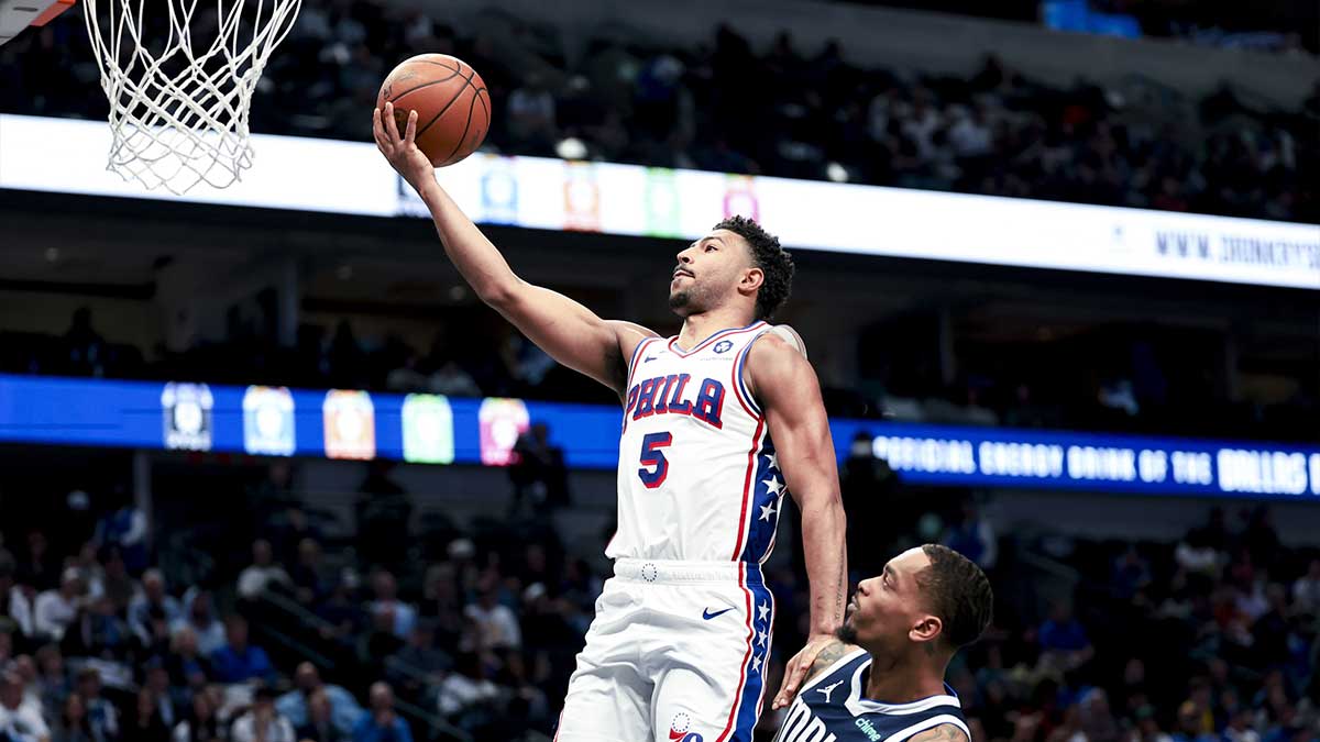  Philadelphia 76ers guard Quentin Grimes (5) shoots past Dallas Mavericks forward P.J. Washington (25) during the second half at American Airlines Center. 