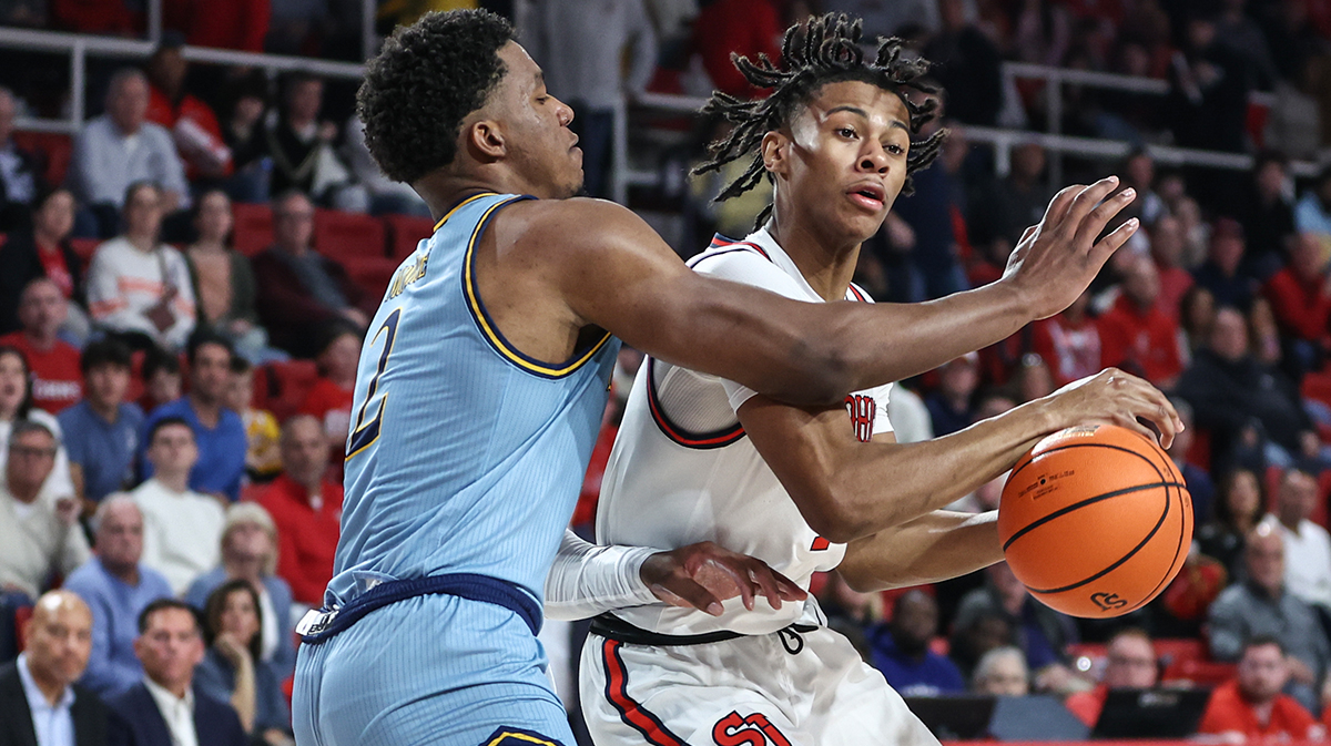 St. John's Red Storm guard Simeon Wilcher (7) looks to drive past Quinnipiac Bobcats forward Amarri Monroe (2) in the second half at Carnesecca Arena.