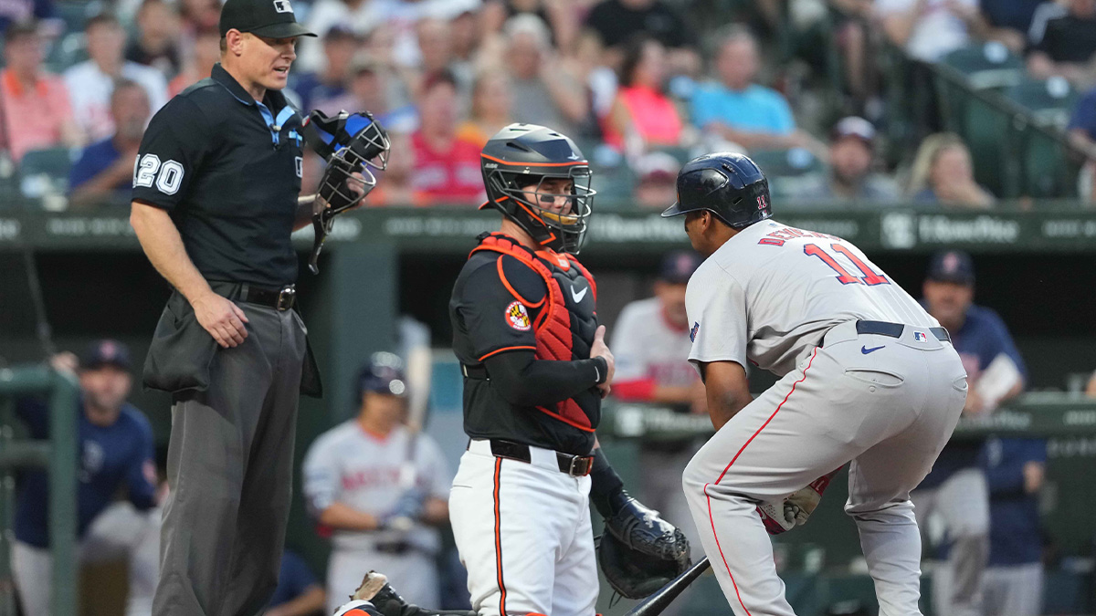 Aug 15, 2024; Baltimore, Maryland, USA; Boston Red Sox third baseman Rafael Devers (11) reacts after being called out on strikes in the fourth inning by umpire Brian Walsh against the Baltimore Orioles at Oriole Park at Camden Yards.