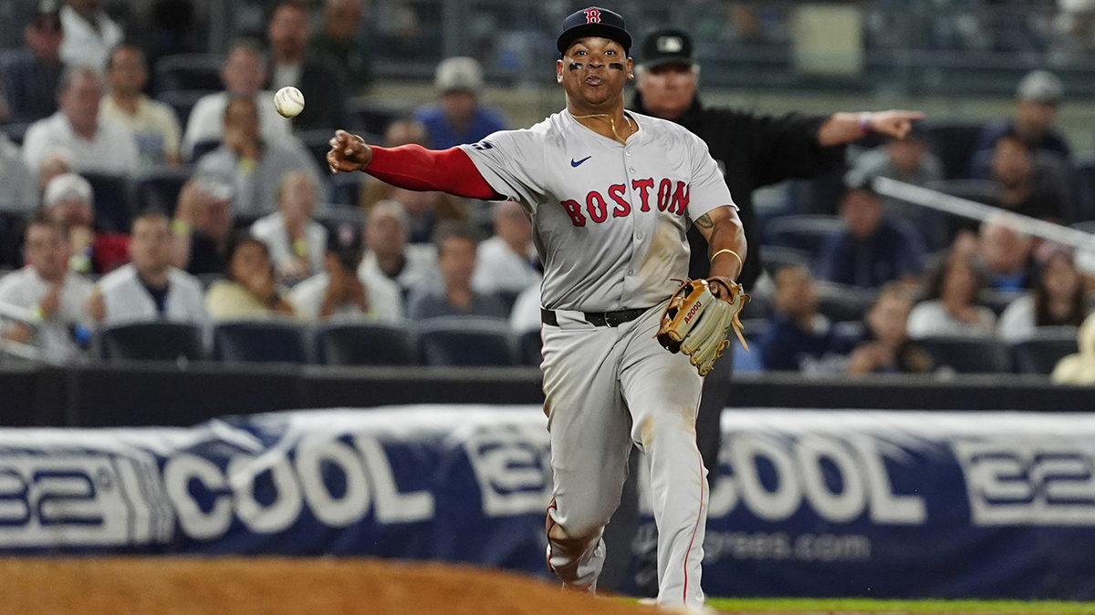 Boston Red Sox third baseman Rafael Devers (11) throws out New York Yankees shortstop Anthony Volpe (not pictured) after fielding a ground ball during the ninth inning at Yankee Stadium. 