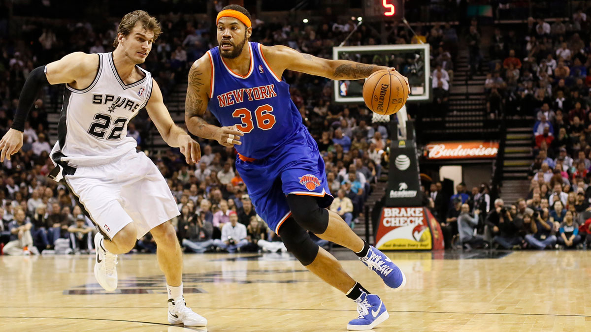 New York Knicks forward Rasheed Wallace (36) drives to the basket as San Antonio Spurs forward Tiago Splitter (22) defends during the second half at the AT&T Center. The Knicks won 104-100.