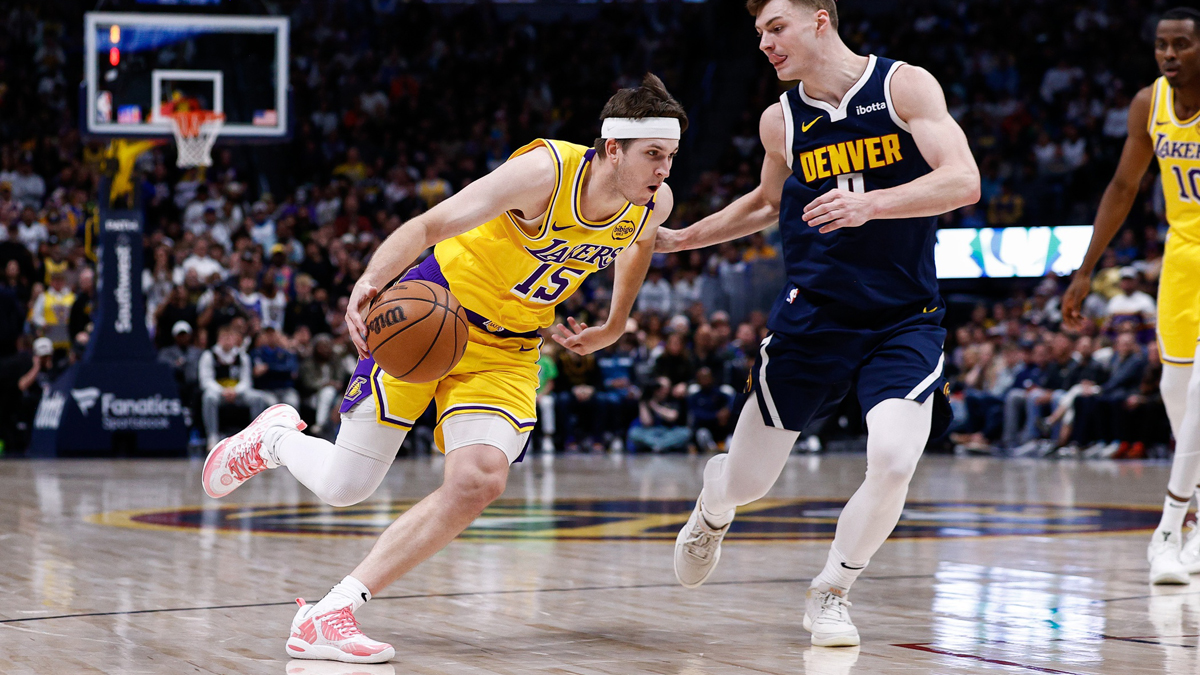 Los Angeles Lakers Guard Austin Reaves (15) Drive to Cart vs. Denver Nuggets Guard Christian Brown (0) In the fourth quarter of the balls.