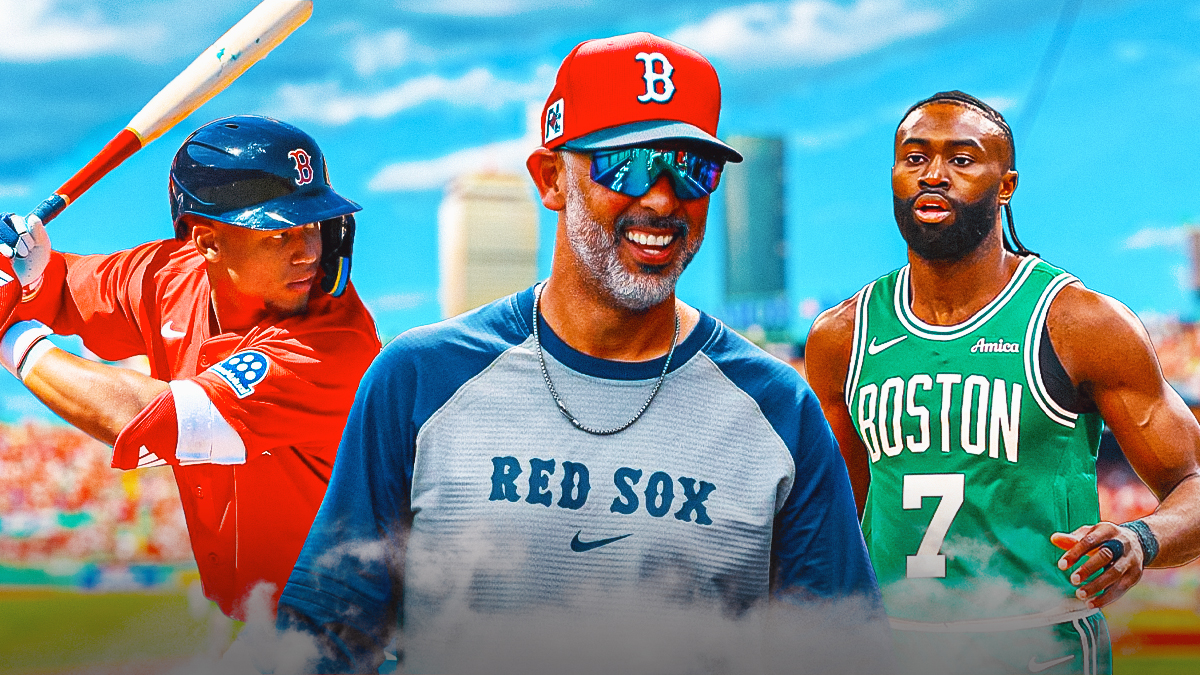 Kristian Campbell in a Boston Red Sox uniform next to Jaylen Brown in a Boston Celtics uniform with Red Sox manager Alex Cora in the middle as Campbell gets a comp to brown by cora during red sox spring training.