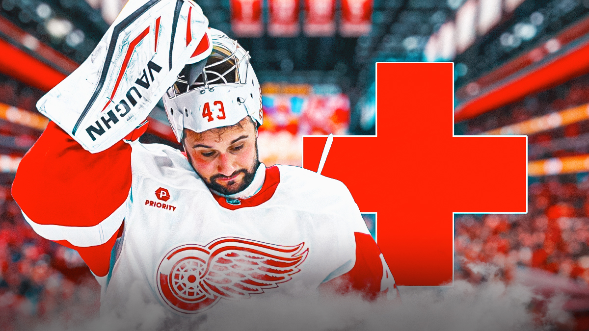 Red Wings star Petr Mrazek with a red medical cross behind him.