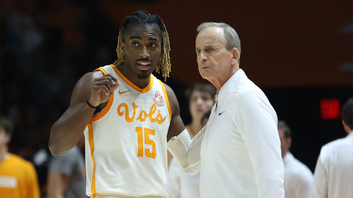 Tennessee Volunteers guard Jahmai Mashack (15) speaks with head coach Rick Barnes during the first half against the Alabama Crimson Tide at Thompson-Boling Arena at Food City Center.