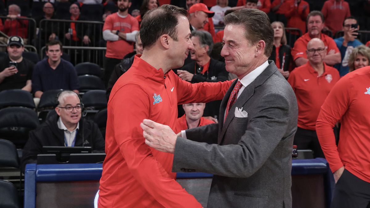 New Mexico Lobos head coach Richard Pitino and St. John's Red Storm head coach Rick Pitino greet each other prior to the start of the game at Madison Square Garden