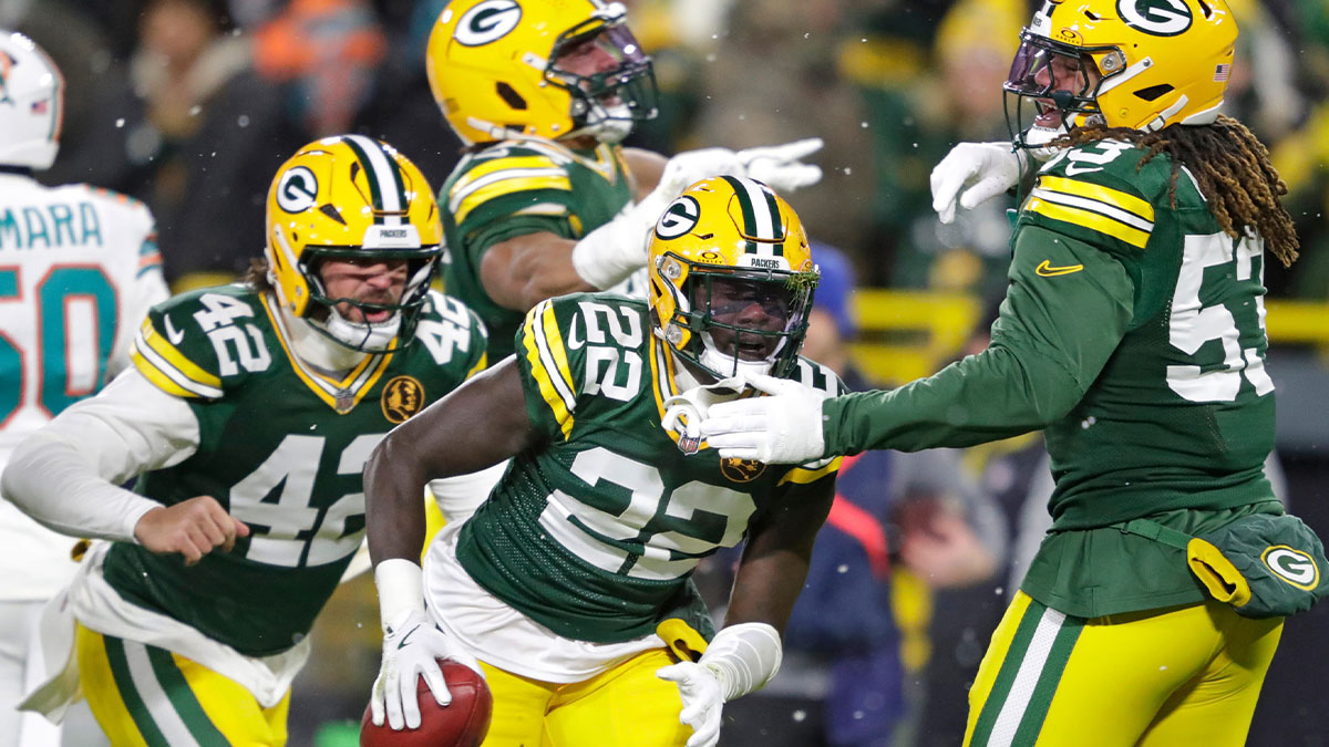 Green Bay Packers cornerback Robert Rochell (22) celebrates recovering a fumble on a punt return against the Miami Dolphins during their football game.