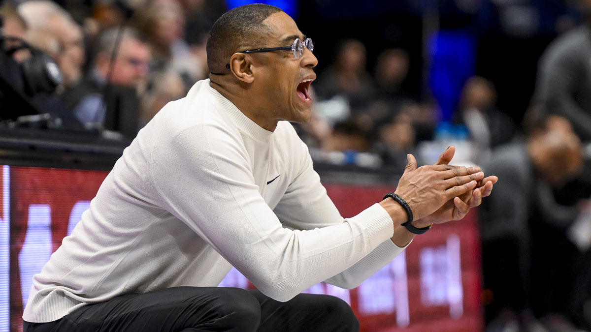 Texas Longhorns head coach Rodney Terry cheers his team on against the Vanderbilt Commodores during the second half at Bridgestone Arena.