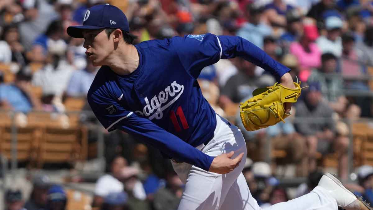 Los Angeles Dodgers pitcher Roki Sasaki (11) throws against the Cleveland Guardians in the first inning at Camelback Ranch-Glendale. 