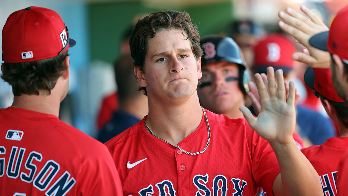 Boston Red Sox outfielder Roman Anthony (48) is congratulated after he scored a run against the Philadelphia Phillies during the third inning at BayCare Ballpark.