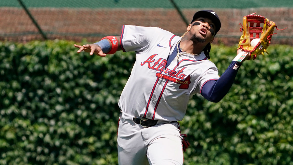 Atlanta Braves outfielder Ronald Acuña Jr. (13) catches a ball hit by Chicago Cubs outfielder Cody Bellinger (not pictured) during the third inning at Wrigley Field.