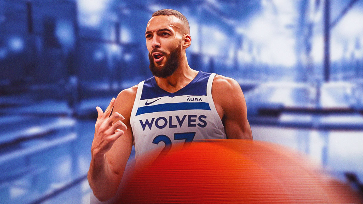Timberwolves' Rudy Gobert pointing at himself while standing in a room full of mirrors