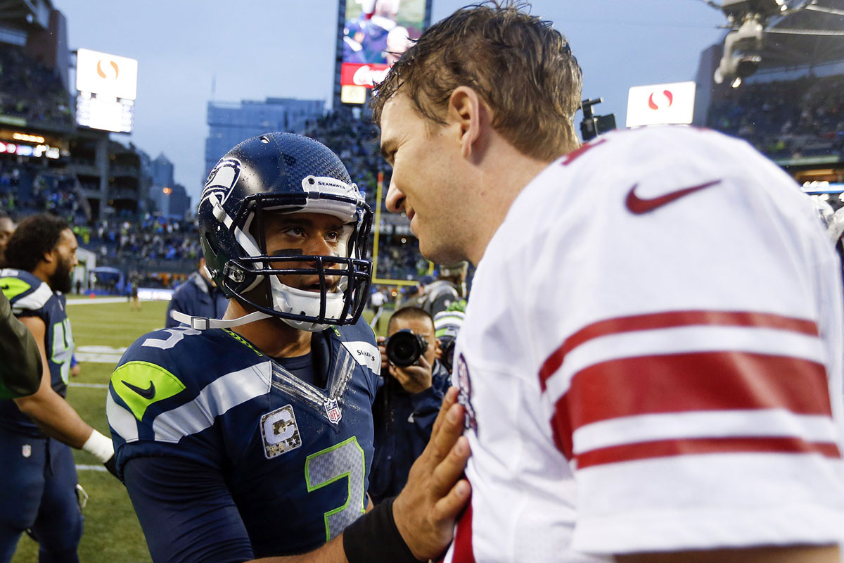 Russell Wilson and Eli Manning after a game between the Seattle Seahawks and New York Giants in 2014.