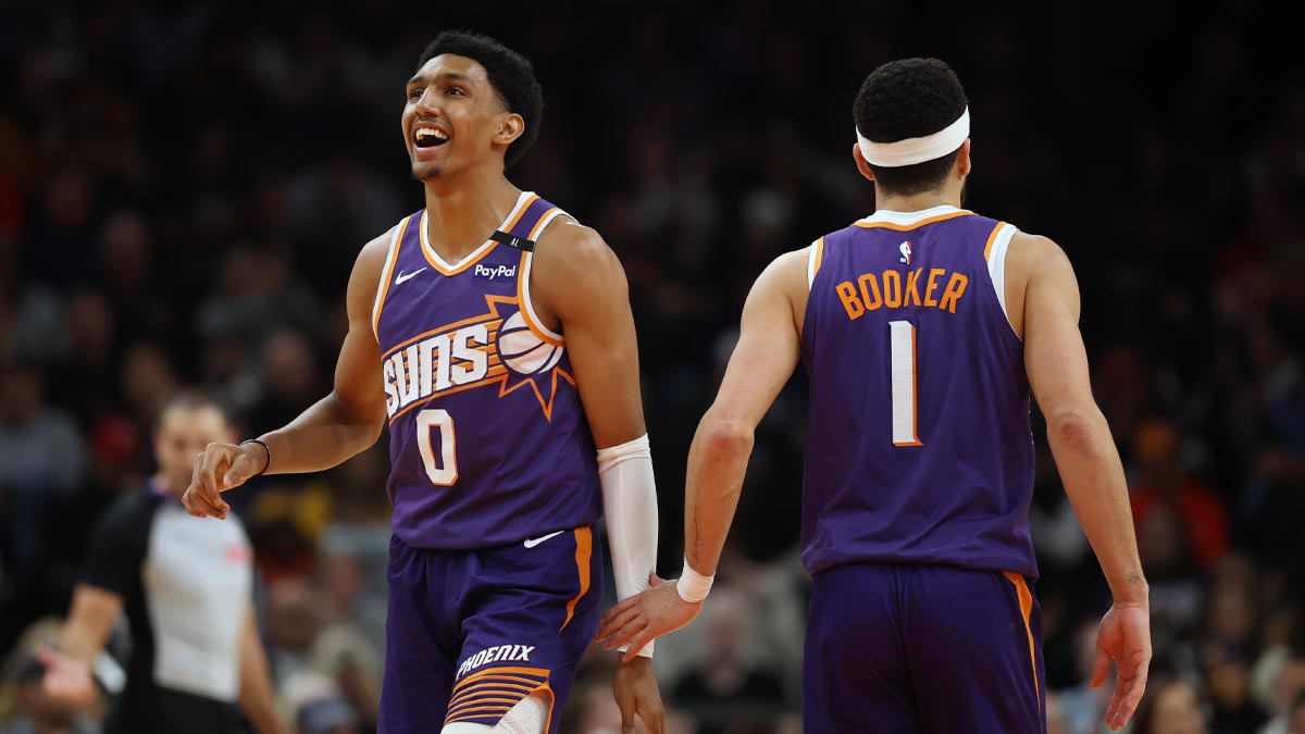 Phoenix Suns forward Ryan Dunn (0) and guard Devin Booker (1) against the Atlanta Hawks in the second half at Footprint Center