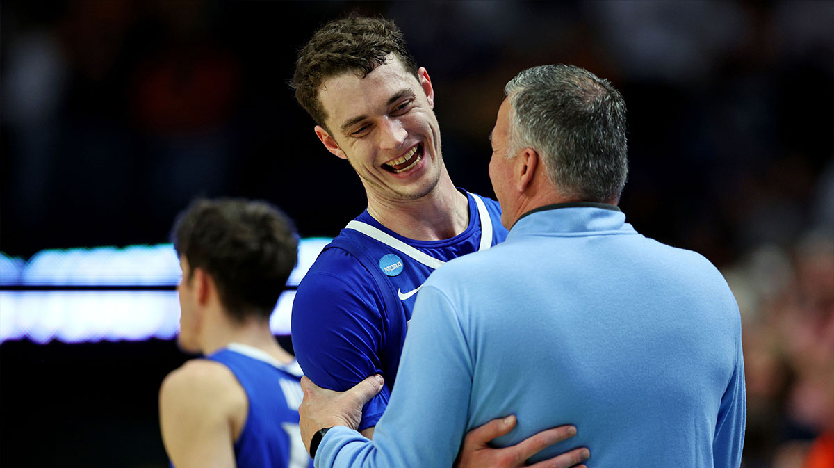 Creighton Bluejays center Ryan Kalkbrenner (11) reacts with head coach Greg McDermott during the second half against the Auburn Tigers in the second round to the NCAA Tournament at Rupp Arena.