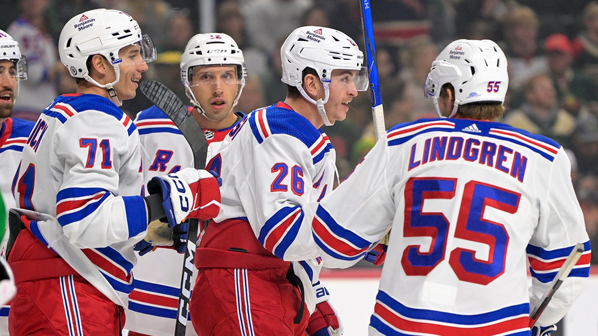 New York Rangers forward Jimmy Vesey (26) celebrates his goal against the Minnesota Wild with forward Tyler Pitlick (71) and defenseman Ryan Lindgren (55) during the first period at Xcel Energy Center.