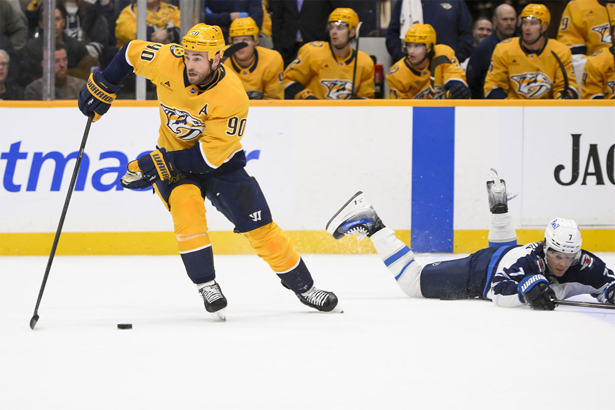 Nashville Predators center Ryan O'Reilly (90) steals the puck from Winnipeg Jets center Vladislav Namestnikov (7) during the second period at Bridgestone Arena.