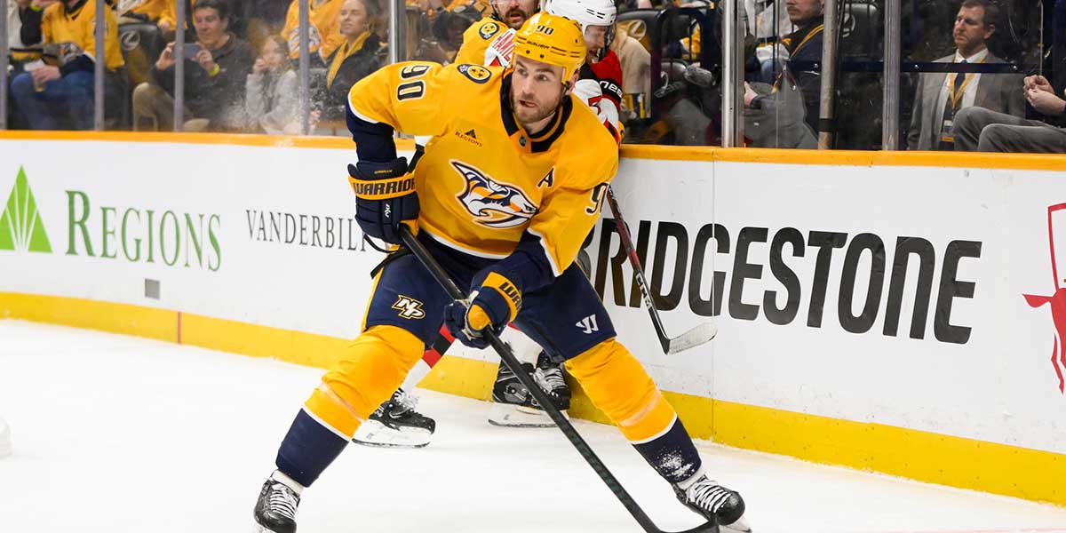 Nashville Predators center Ryan O'Reilly (90) skates behind the net against the New Jersey Devilsduring the first half at Bridgestone Arena.