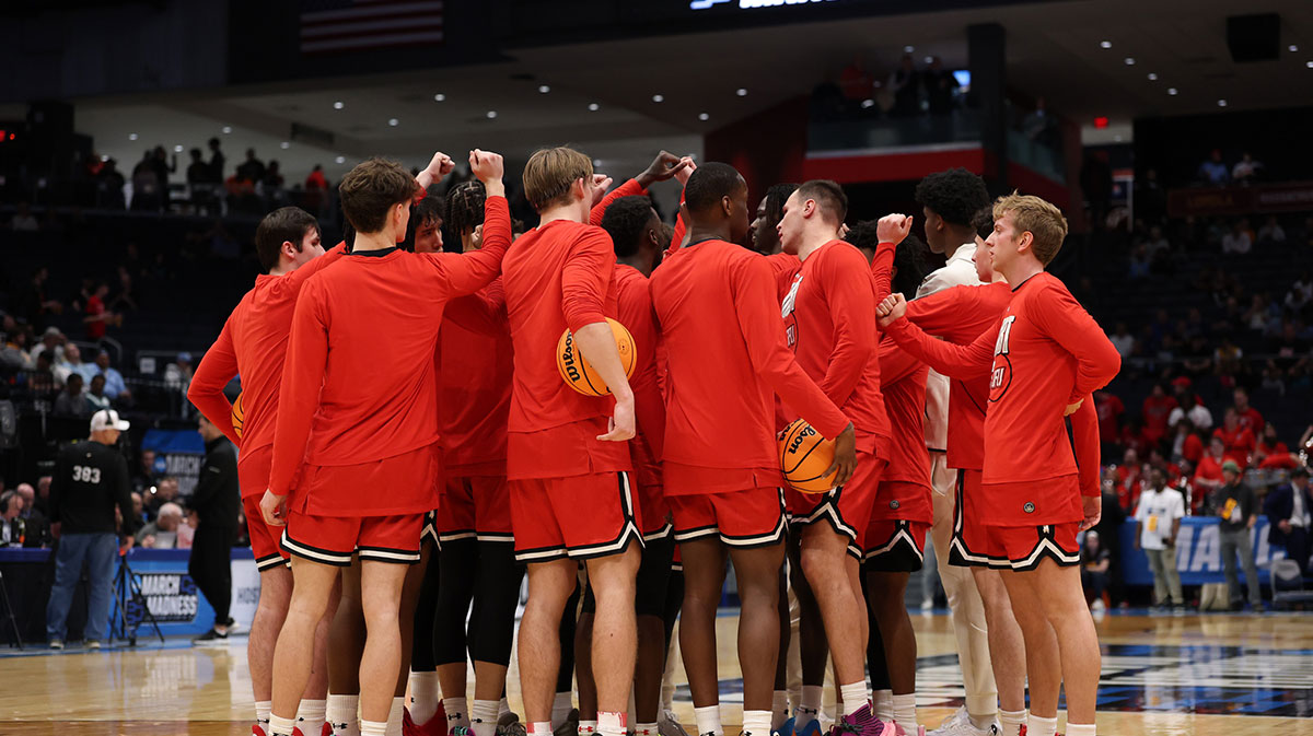 The St. Francis (Pa) Red Flash huddle together before the game against the Alabama State Hornets at UD Arena in Division III Presidents' Athletic Conference.