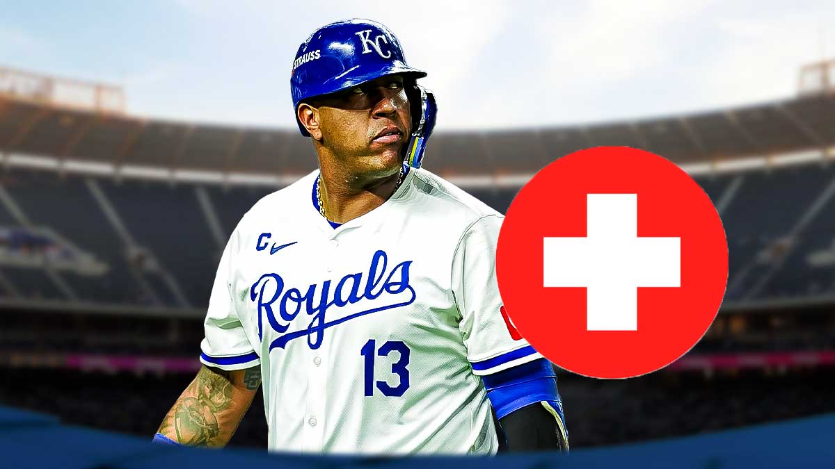 Salvador Perez in a Kansas City Royals uniform with a red and white first aid symbol as Perez left the royals spring training game with an injury.
