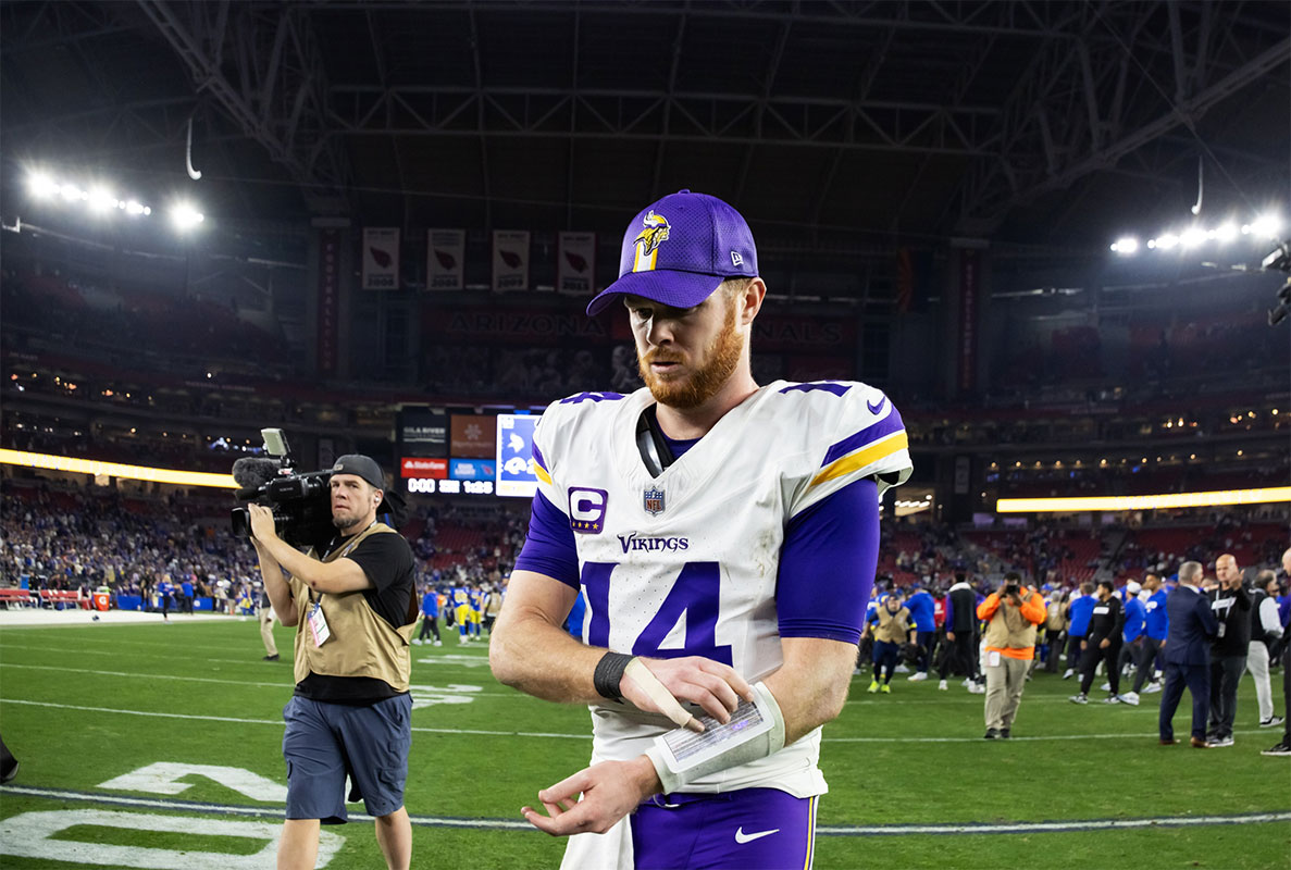 Jan 13, 2025; Glendale, AZ, USA; Minnesota Vikings quarterback Sam Darnold (14) reacts as he walks off the field after losing to the Los Angeles Rams during an NFC wild card game at State Farm Stadium.