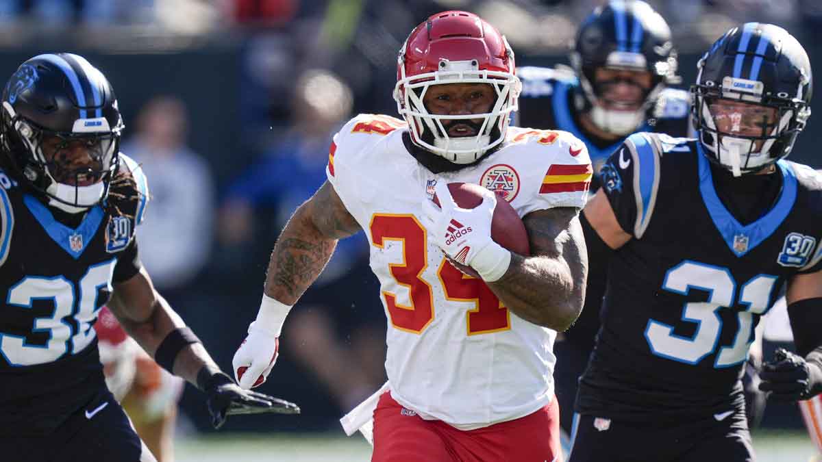 Nov 24, 2024; Charlotte, North Carolina, USA; Kansas City Chiefs running back Samaje Perine (34) runs for yardage against the Carolina Panthers during the first quarter at Bank of America Stadium. 