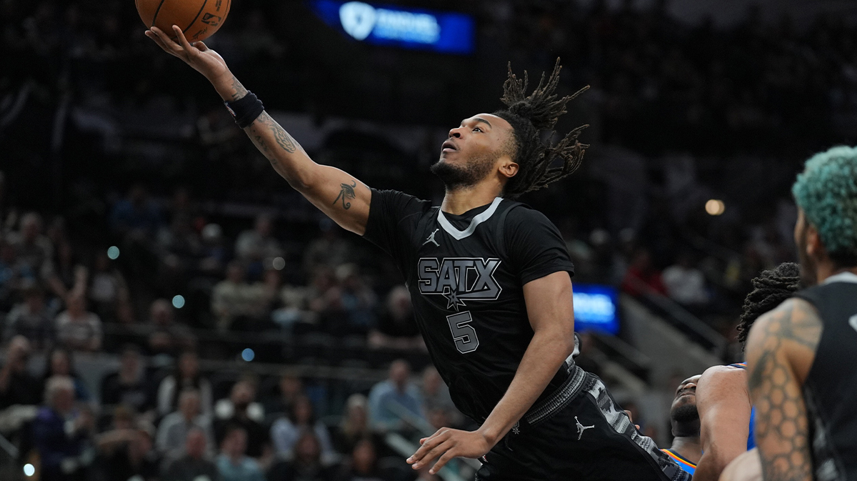 San Antonio Spurs guard Stephon Castle (5) lays the ball up in the first half against the Oklahoma City Thunder at Frost Bank Center. 