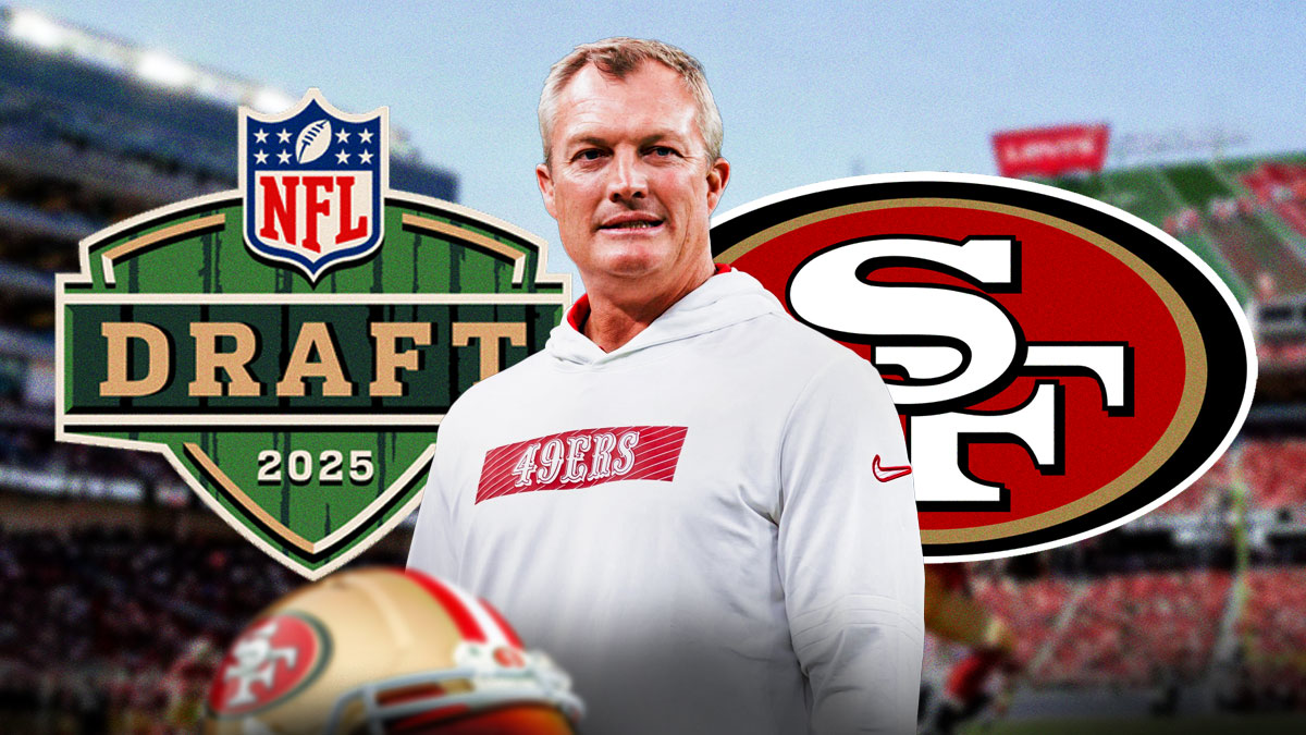 49ers John Lynch with 2025 NFL Draft logo and San Francisco 49ers logo behind him