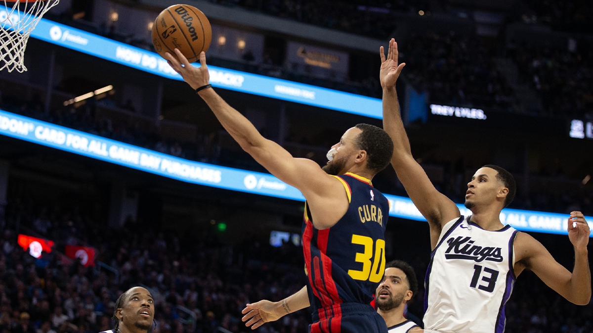 Golden State Warriors guard Stephen Curry (30) lays the ball up ahead of Sacramento Kings forward Keegan Murray (13) during the third quarter at Chase Center.