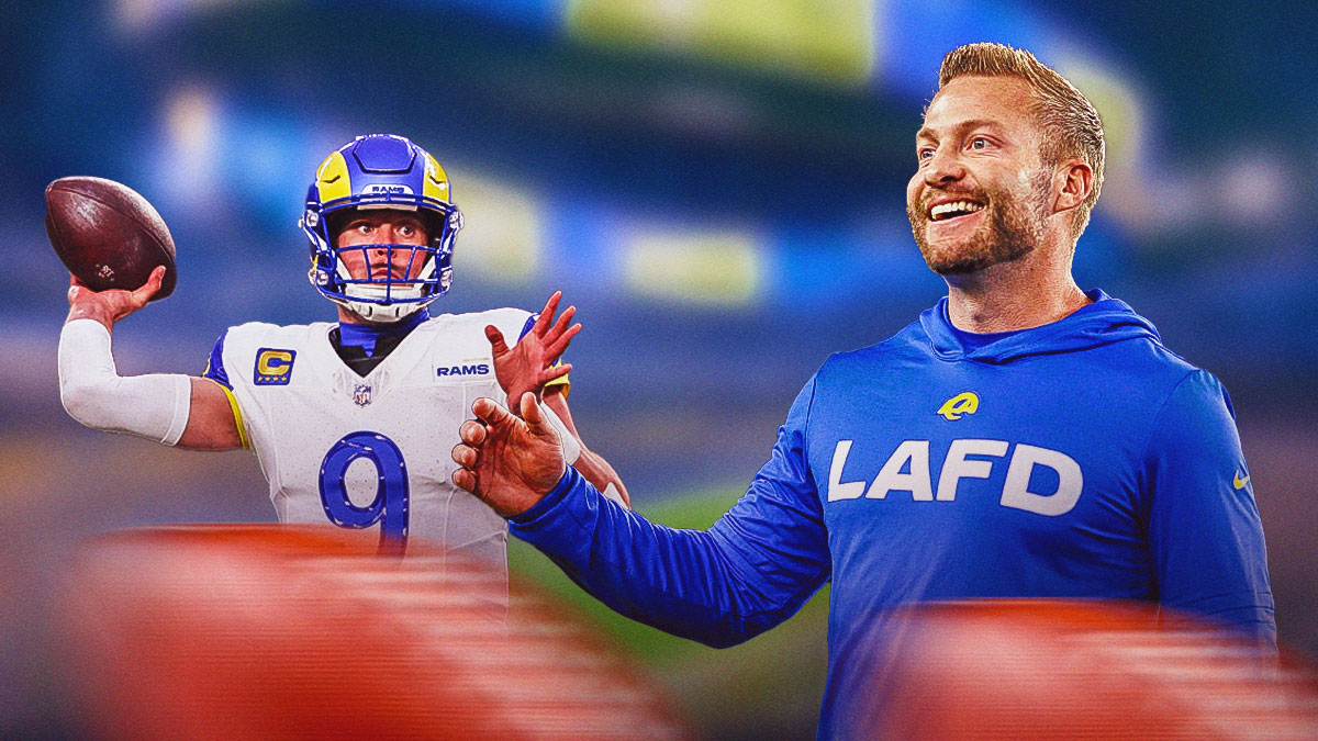 Sean McVay beaming with joy. Matthew Stafford next to him throwing a football
