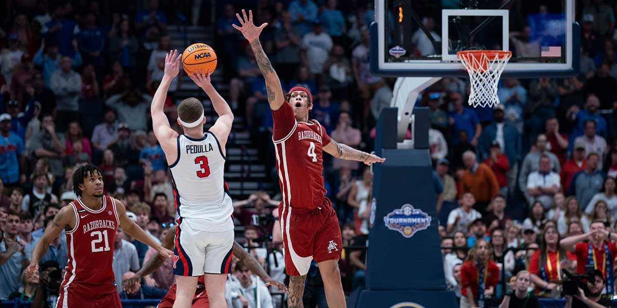 Mississippi Rebels guard Sean Pedulla (3) shoots over Arkansas Razorbacks forward Trevon Brazile (4) for the game-winning shot during their second round game of the SEC Men's Basketball Tournament at Bridgestone Arena in Nashville, Tenn., Thursday, March 13, 2025. The Rebels advanced to the third round with the 83-80 win.