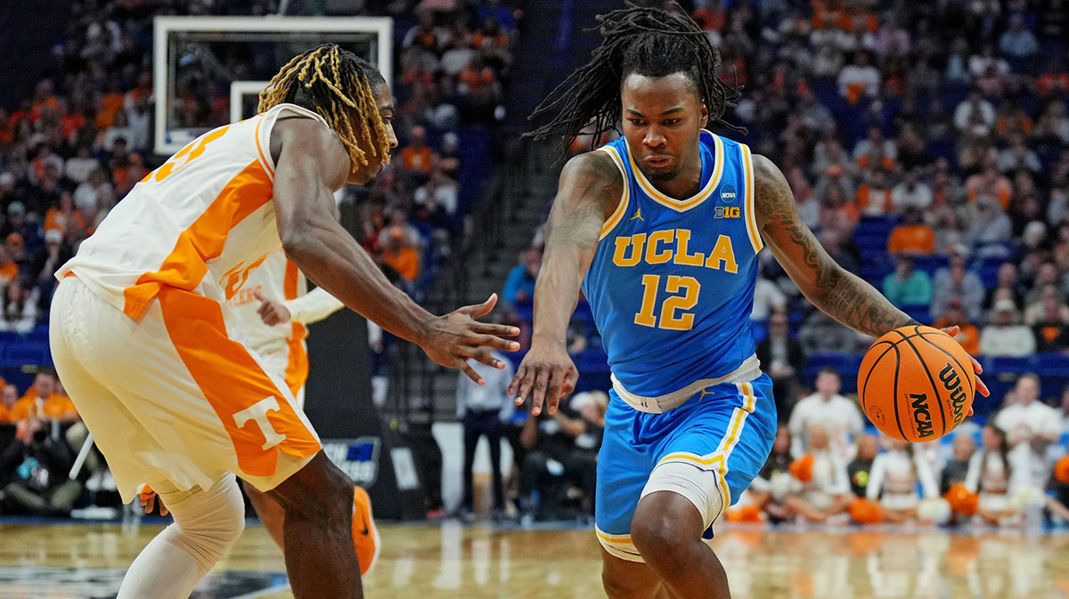 UCLA Bruins guard Sebastian Mack (12) drives to the basket against Tennessee Volunteers forward Felix Okpara (34) during the second half in the second round of the NCAA Tournament at Rupp Arena. Mandatory Credit: Aaron Doster-Imagn Images