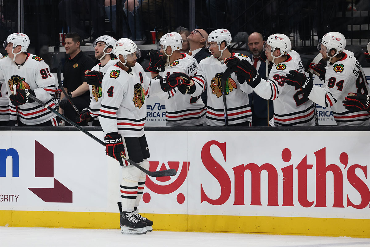 Chicago Blackhawks defenseman Seth Jones (4) celebrates a goal against the Utah Hockey Club with the bench during the first period at Delta Center.