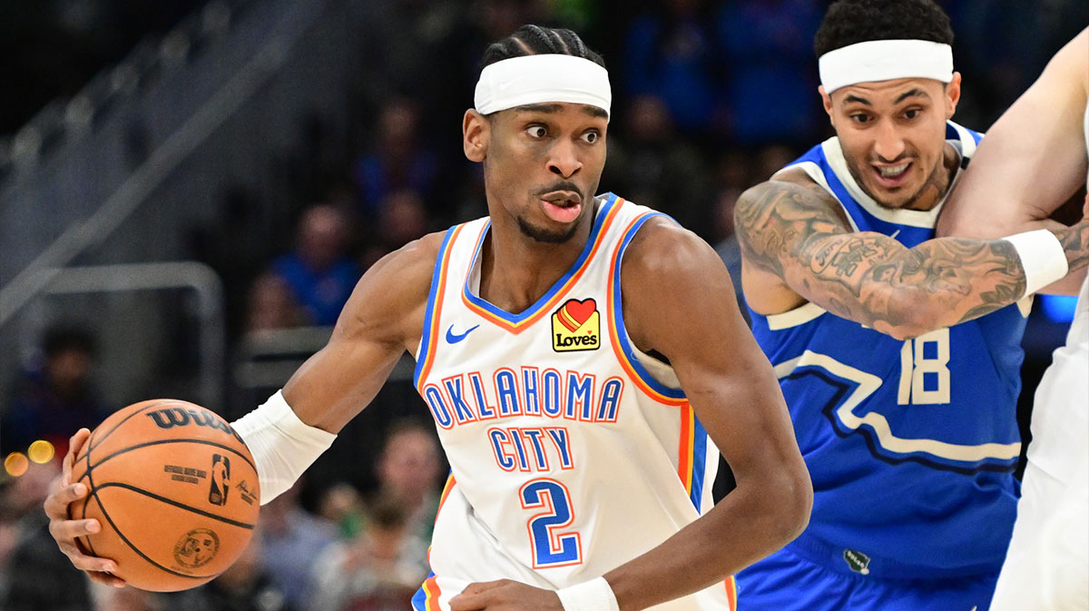 Oklahoma City Thunder Guard Shai Gilgeous-Alexander (2) Cart vehicles against Milwaukee Buck forward Kyle Kuzma (18) in the first quarter of Fiserv Forum. 