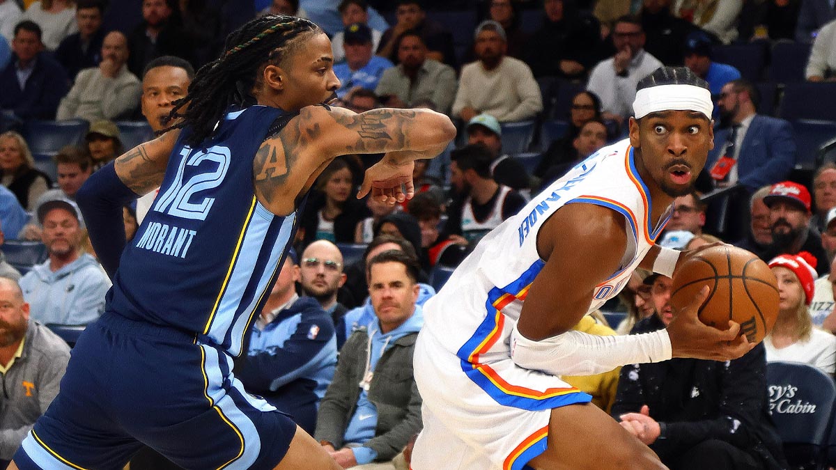 Oklahoma City Thunder Guard Shai Gilgeous-Alexander (2) Handle the ball like Memphis Grizzlies Guard I Morant (12) Defend during the first quarter in FedExforum.