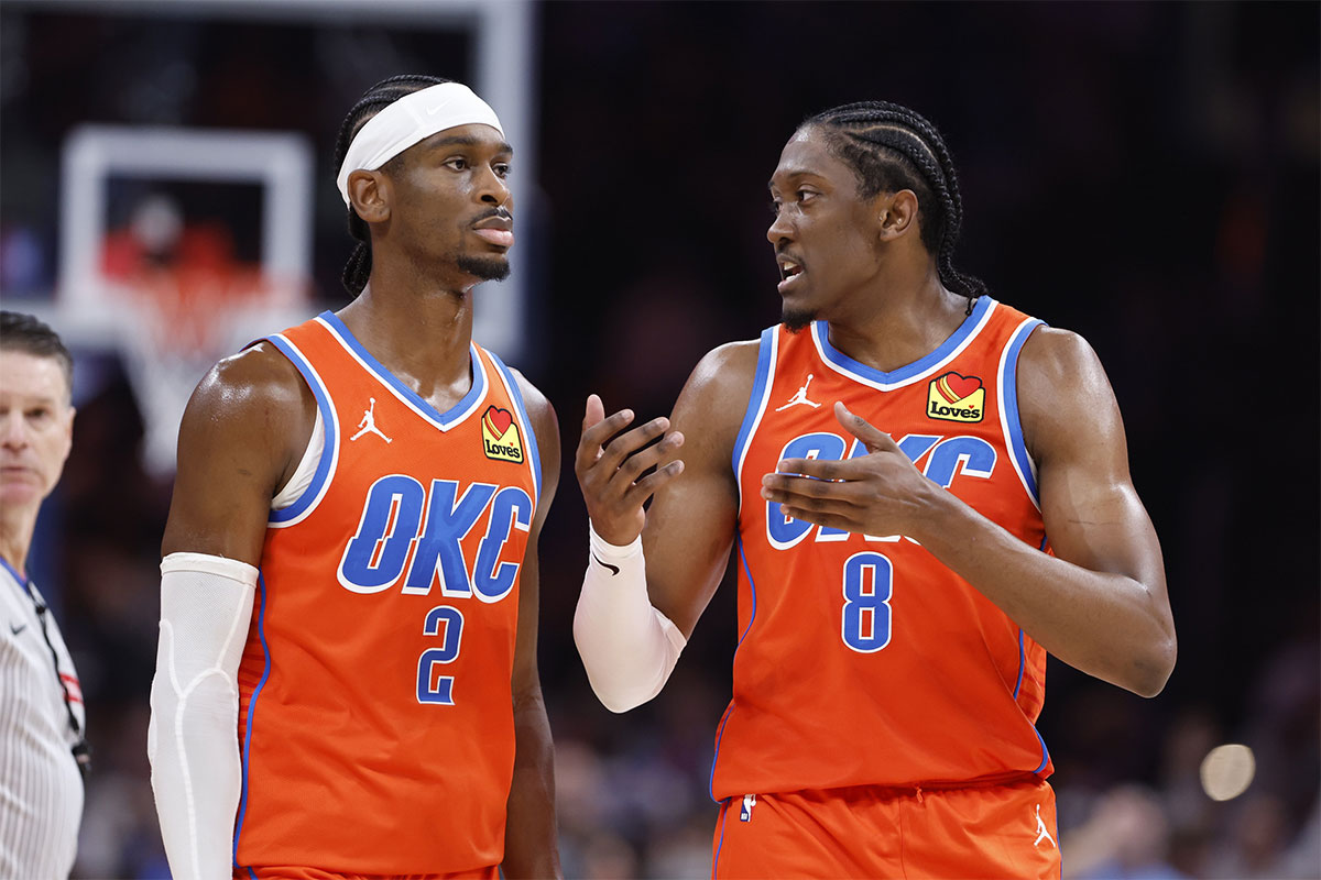 Oklahoma City Thunder guard Shai Gilgeous-Alexander (2) and forward Jalen Williams (8) talk during a time out against the Golden State Warriors during the second half at Paycom Center.