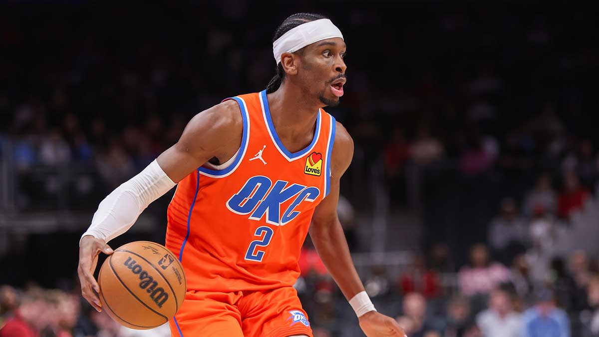  Oklahoma City Thunder guard Shai Gilgeous-Alexander (2) dribbles against the Atlanta Hawks in the first quarter at State Farm Arena.