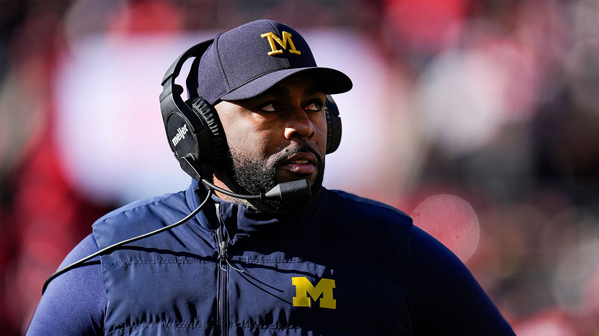 Michigan head coach Sherrone Moore looks on at a timeout against Ohio State during the first half