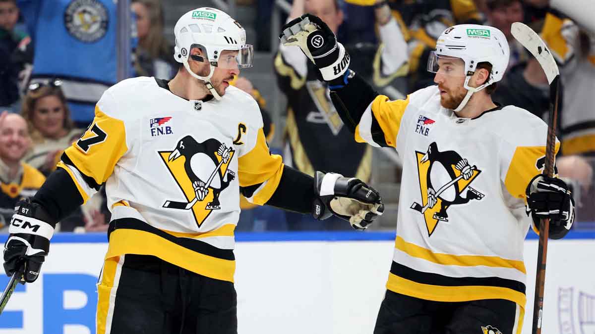 Pittsburgh Penguins center Sidney Crosby (87) celebrates his goal with defenseman Matt Grzelcyk (24) during the first period against the Buffalo Sabres at KeyBank Center.