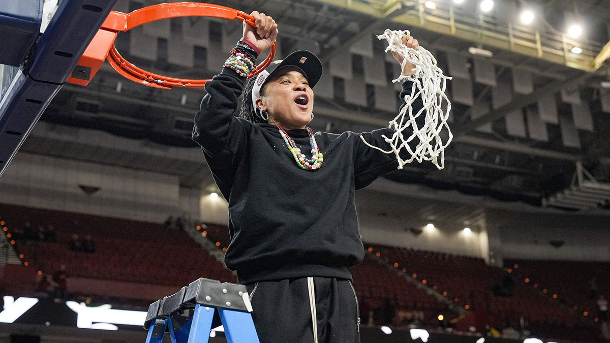 South Carolina Gamecocks head coach Dawn Staley cuts the net down after the win over Texas in the SEC womenís championship.