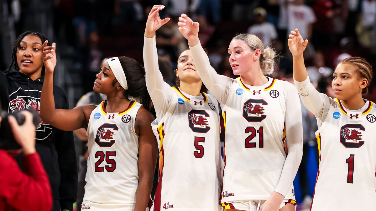 South Carolina Gamecocks forward Ashlyn Watkins (2), guard Raven Johnson (25), guard Tessa Johnson (5), forward Chloe Kitts (21) and guard Maddy McDaniel (1) celebrate following their win against the Indiana Hoosiers at Colonial Life Arena.
