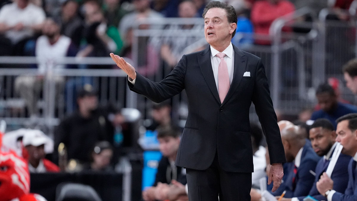 St. John's Red Storm head coach Rick Pitino and Arkansas Razorbacks head coach John Calipari shake hands as the Razorbacks won a second round men’s NCAA Tournament game at Amica Mutual Pavilion.