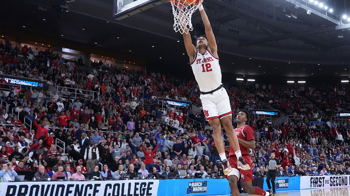 St. John's Red Storm guard RJ Luis Jr. (12) dunks against Arkansas Razorbacks forward Karter Knox (11) during the first half of a second round men’s NCAA Tournament game at Amica Mutual Pavilion.