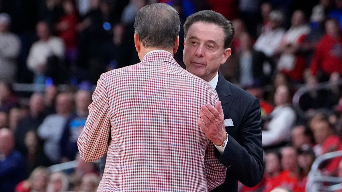 St. John's Red Storm head coach Rick Pitino and Arkansas Razorbacks head coach John Calipari shake hands as the Razorbacks won a second round men’s NCAA Tournament game at Amica Mutual Pavilion.