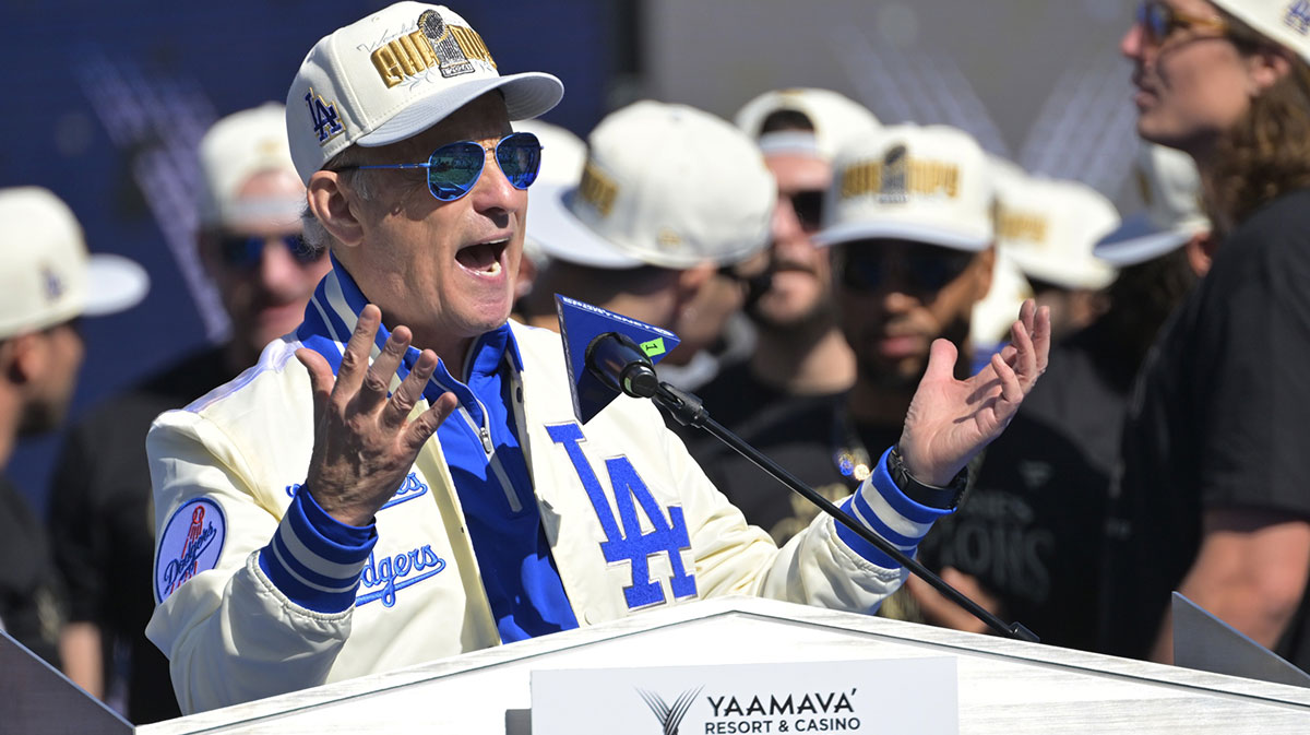 Los Angeles Dodgers owner Stan Kasten speaks to fans during the World Series Championship Celebration at Dodger Stadium.