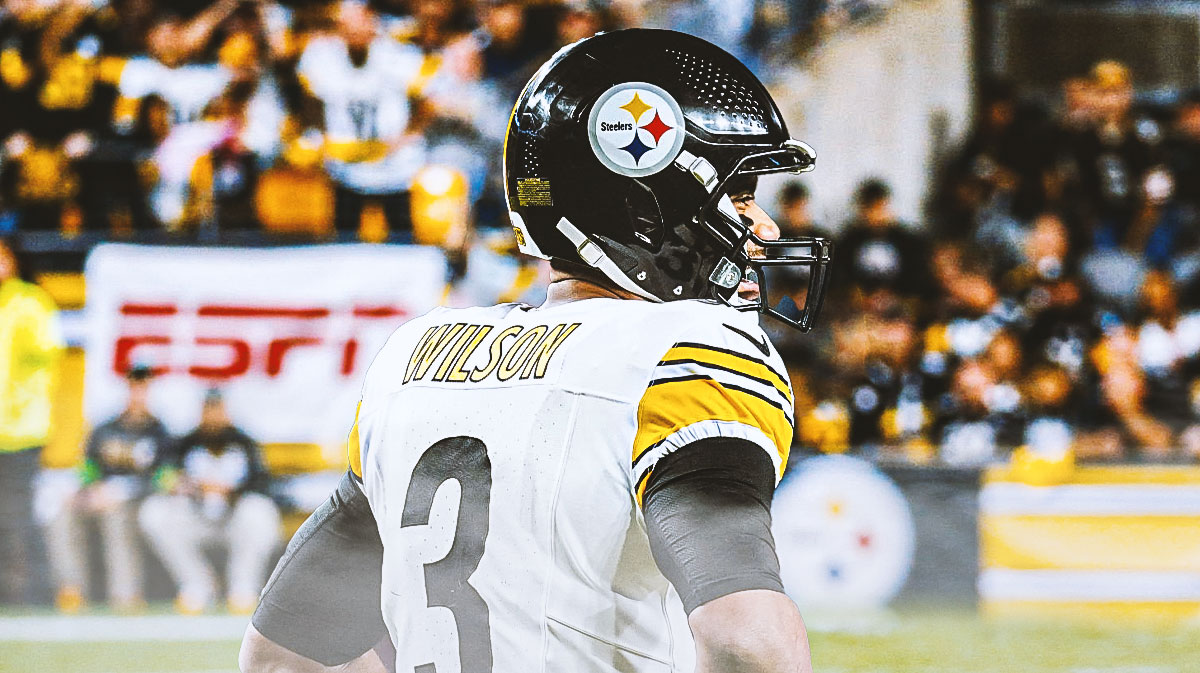 Russell Wilson with his back turned towards the Steelers home stadium.